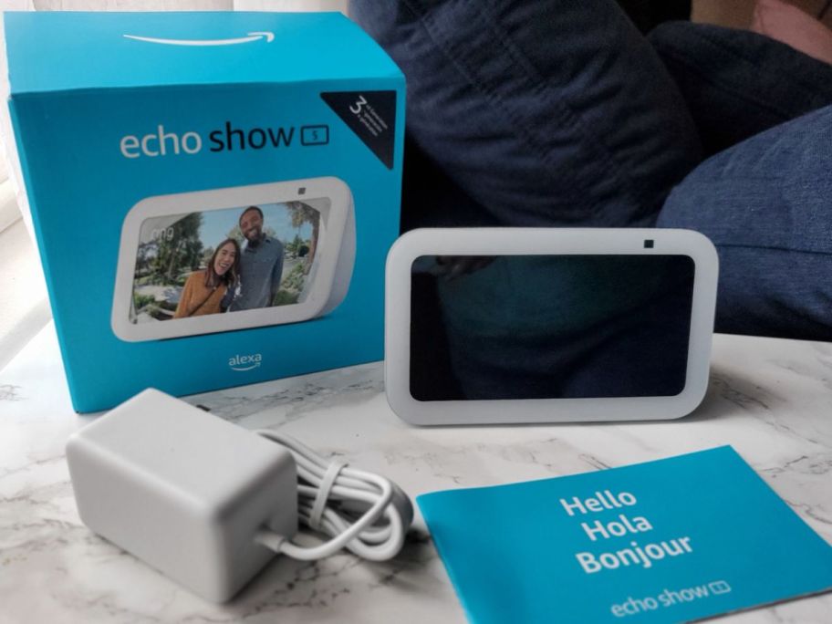 An Amazon Echo Show 5 and al the contest inside the box it comes in