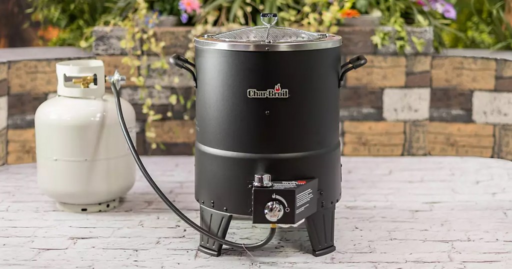 round propane turkey fryer on concrete patio