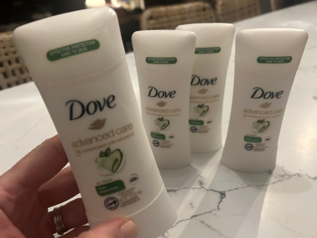 person holding Dove Deodorant