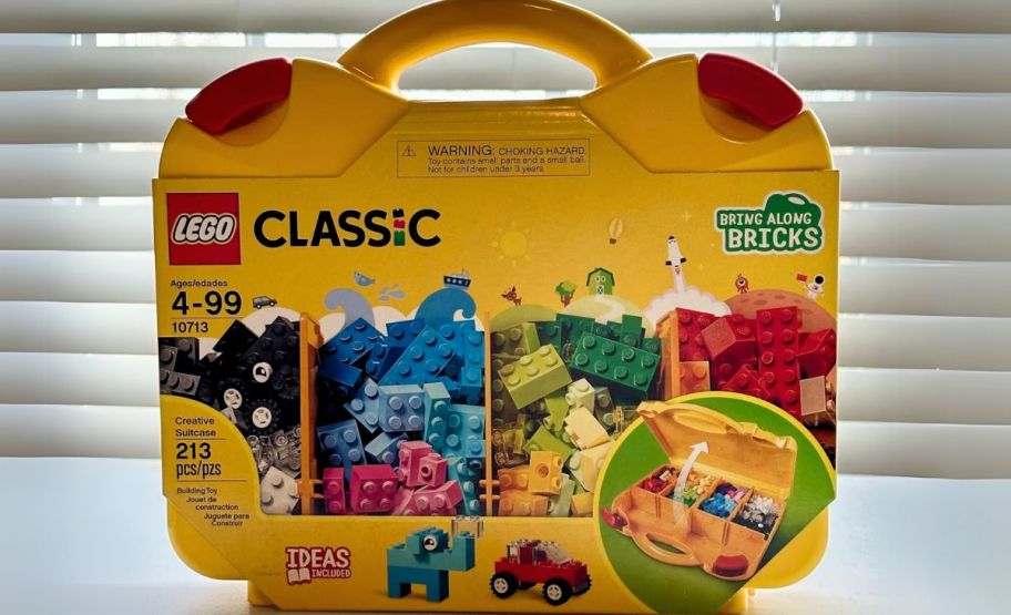 lego classic suitcase on window ledge