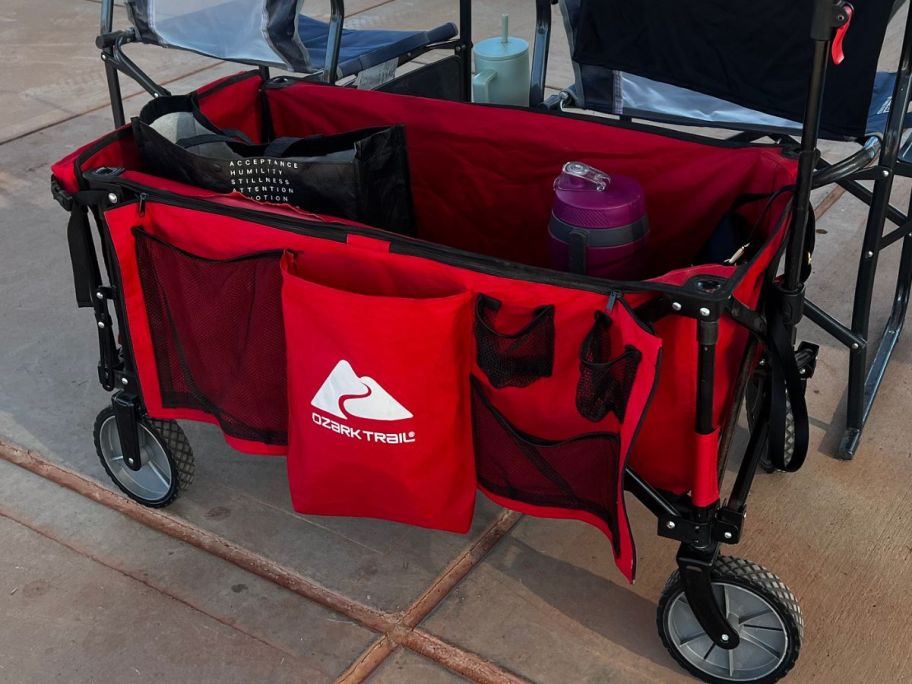 Ozark Trail Wagon behind two folding chairs at the baseball field