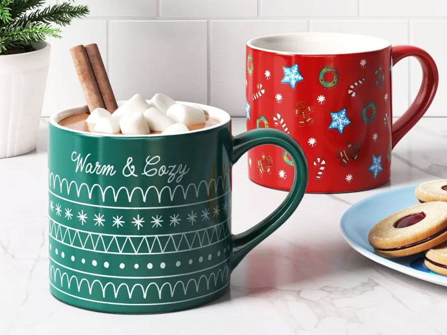green and red christmas mugs on kitchen counter