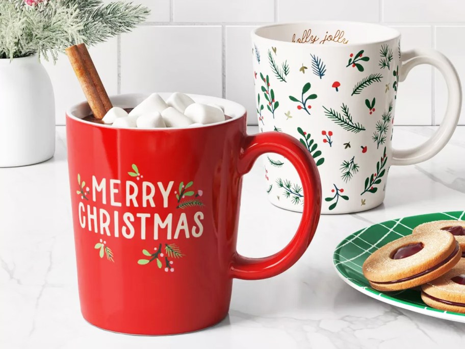 red and white christmas mugs on kitchen counter