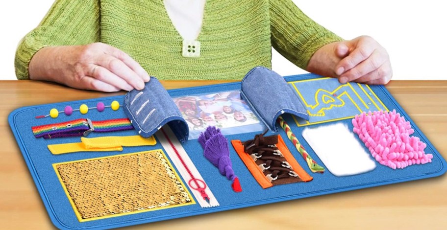 stock photo of blue busy blanket on wood table