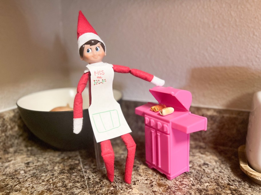 elf cooking on bbq, one of our dollar tree elf on a shelf ideas