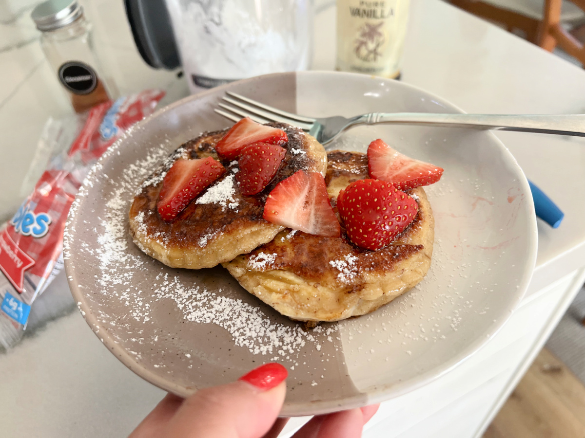 holding a plate with Peanut Butter and Jelly French Toast 