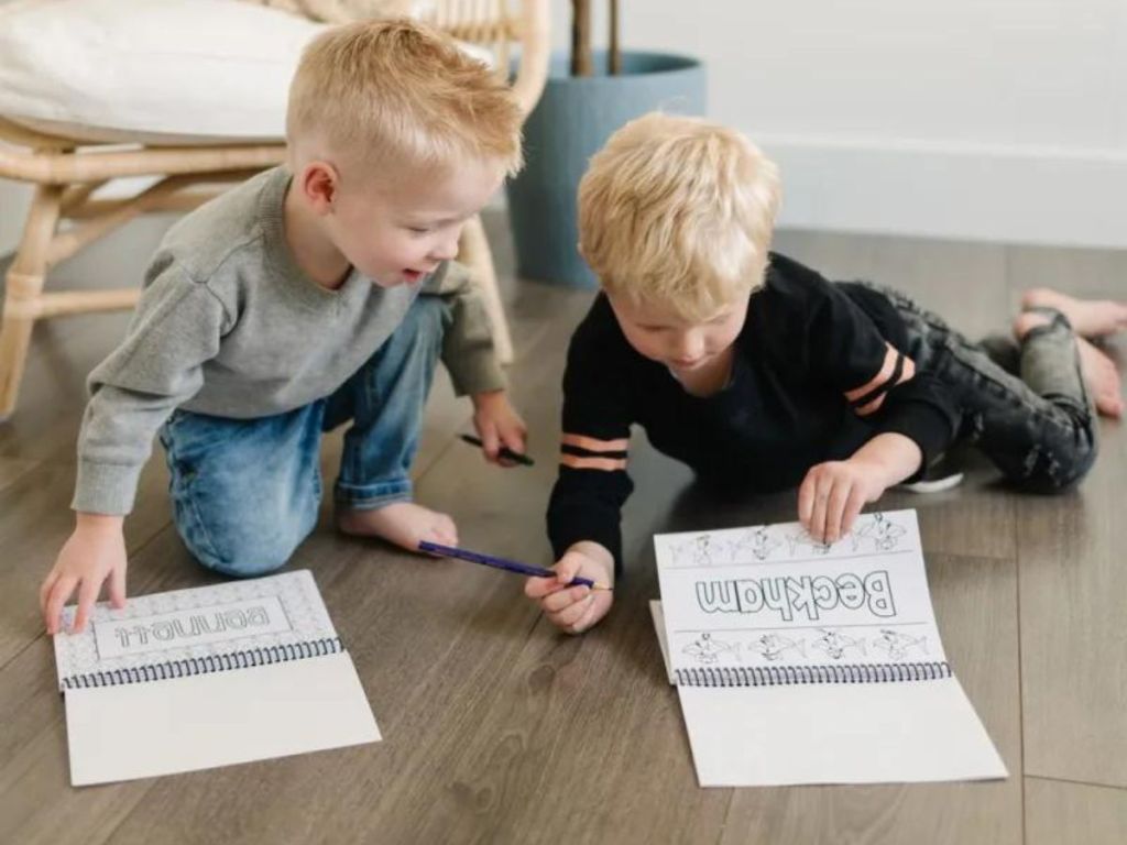two boys coloring in their coloring books
