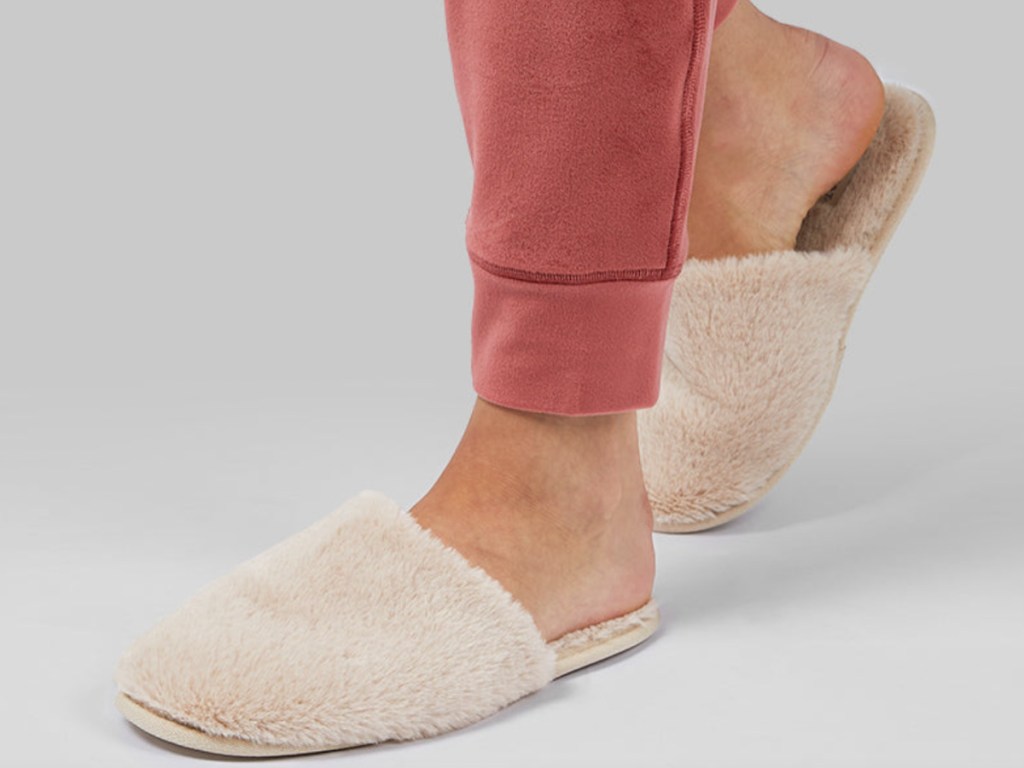 feet in tan plush slippers