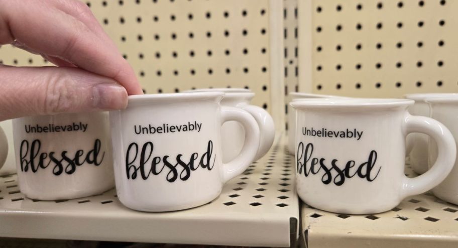 hand holding blessed espresso mug