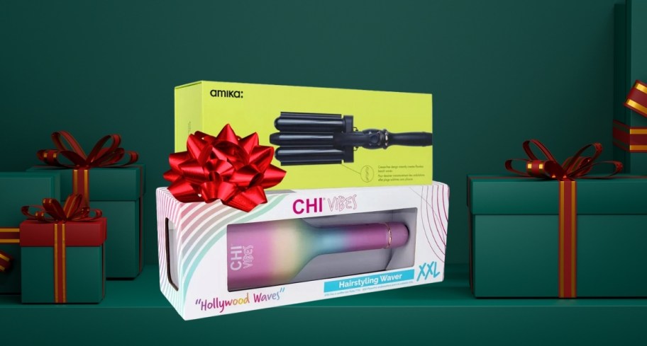 hair tools in boxes with red bow on green background with gifts