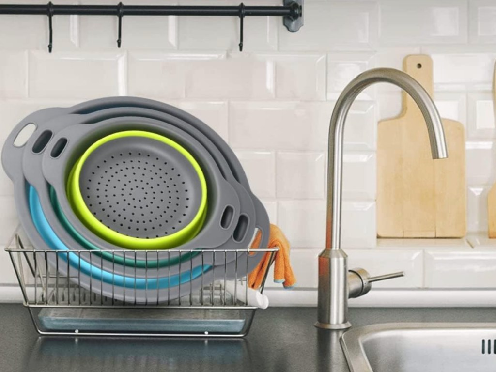 set of 3 Collapsible Colanders in drying track next to sink