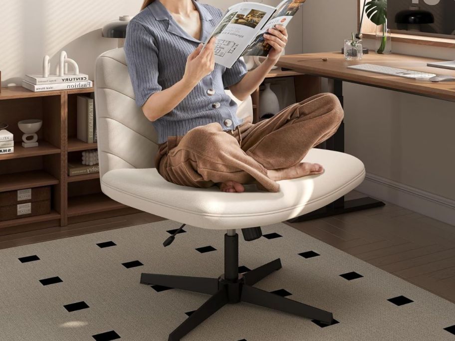 woman sitting on wide crss cross chair 
