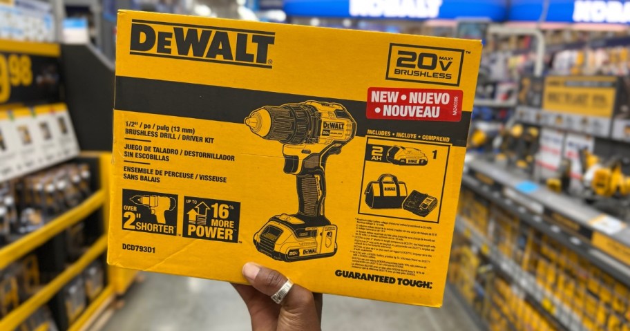 hand holding a yellow and black box for a DeWalt power drill