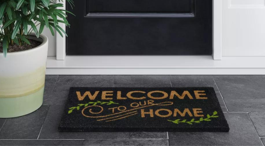 Welcome to our Home Doormat on a porch
