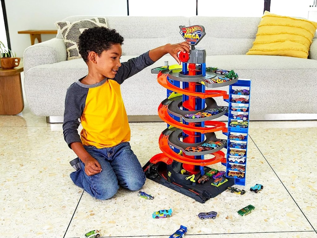 boy playing with hot wheels mega garage set