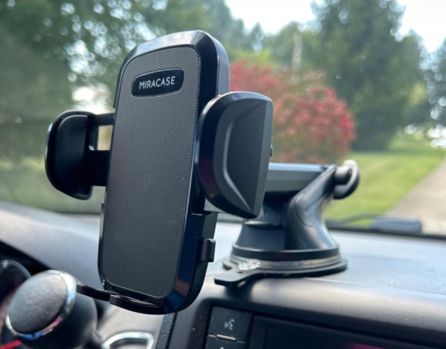 close up of black phone holder on car dash