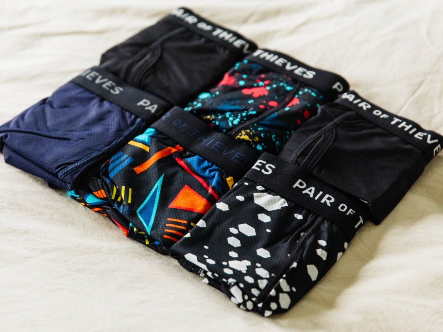 6 folded Pair of Thieves Boxers on bed