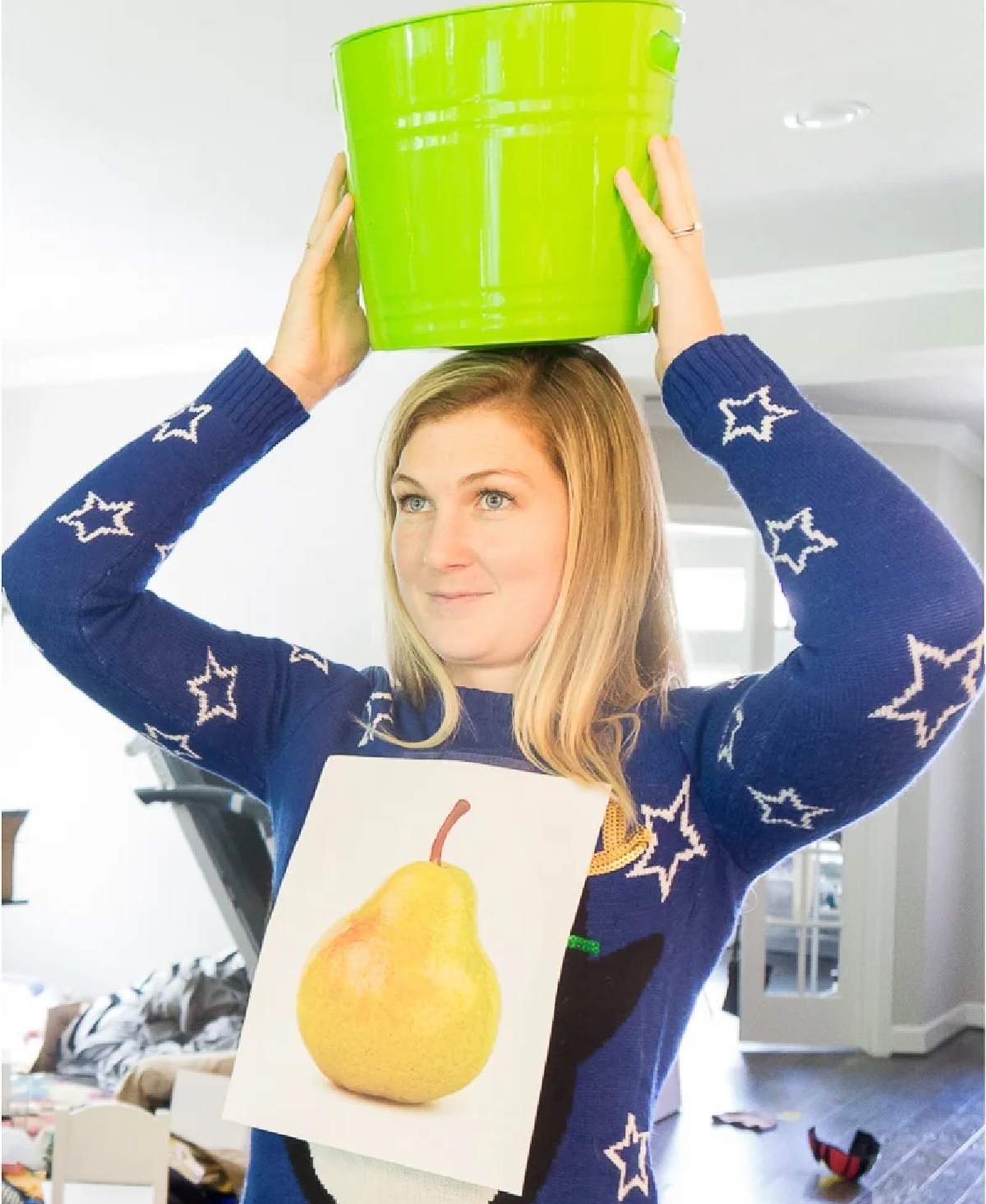 Woman playing "A Patridge In a Pear Tree" which is a minute to win it christmas game