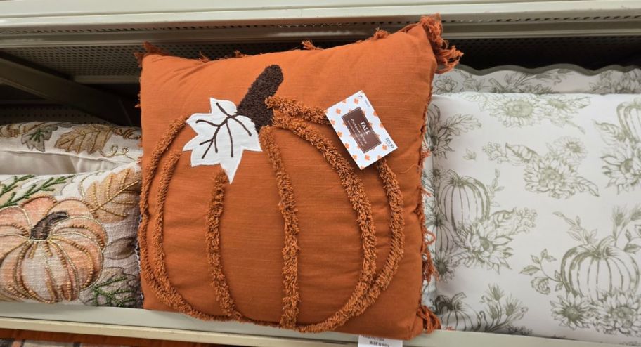 display of three Pumpkin throw pillows