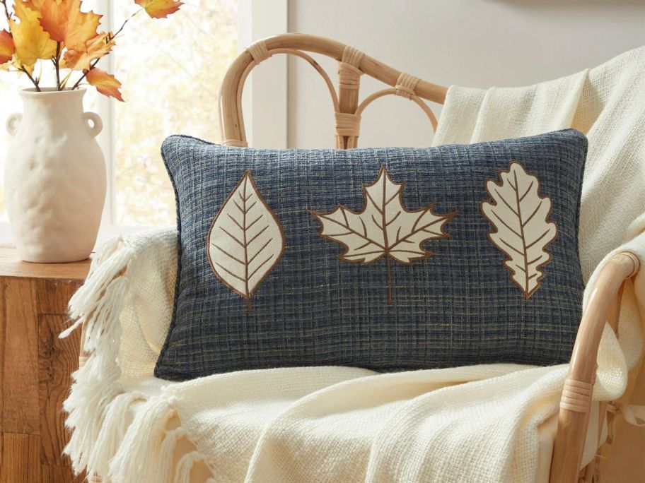 A blue decorative pillow on a chair 