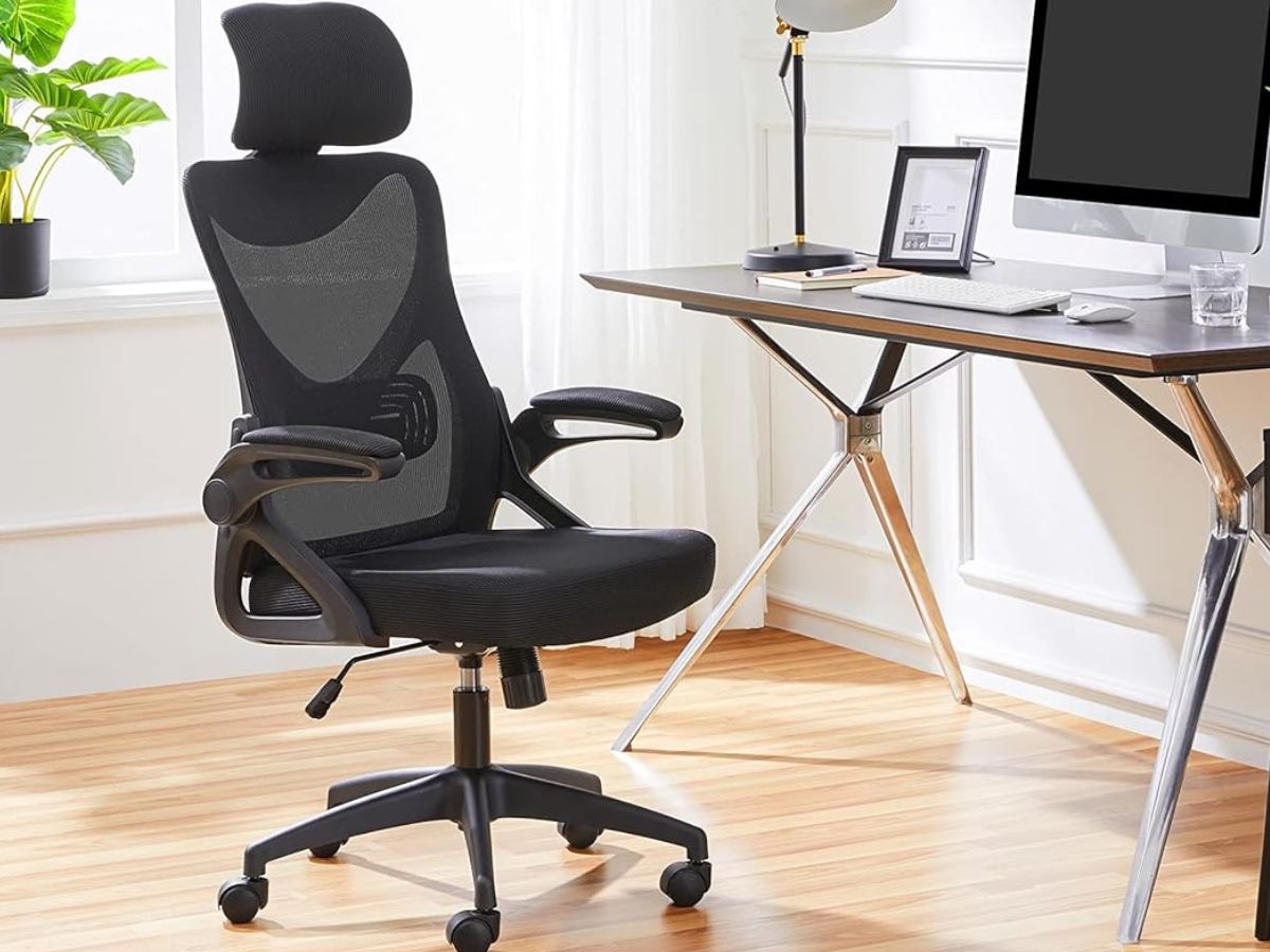 A Yaheetech Mesh Office Chair next to a desk