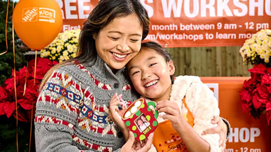 mother and child hugging at the home depot kids workshop