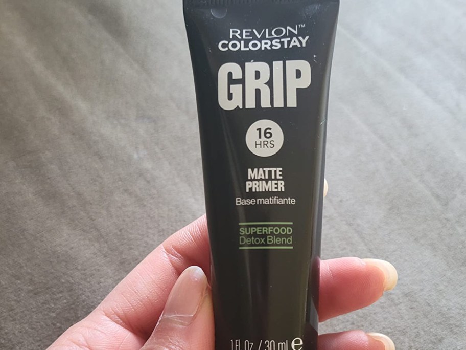 hand holding revlon color stay grip primer