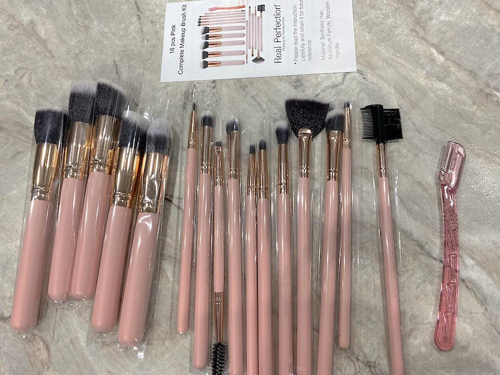 huge makeup brush set on counter 