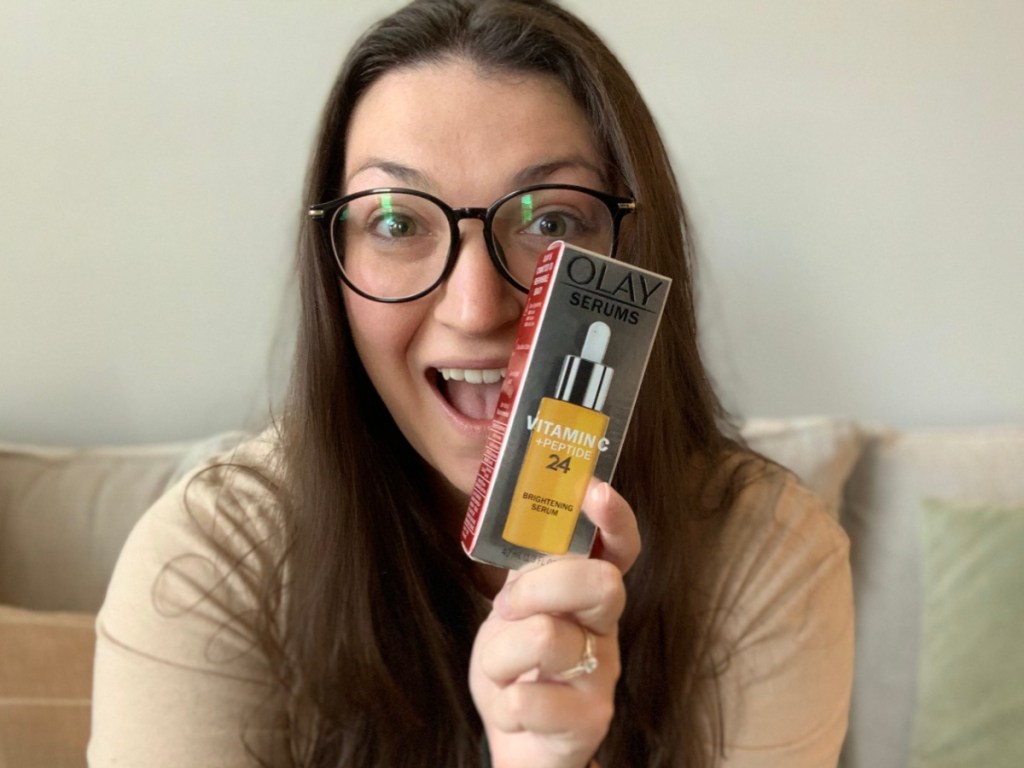 woman holding serum in box