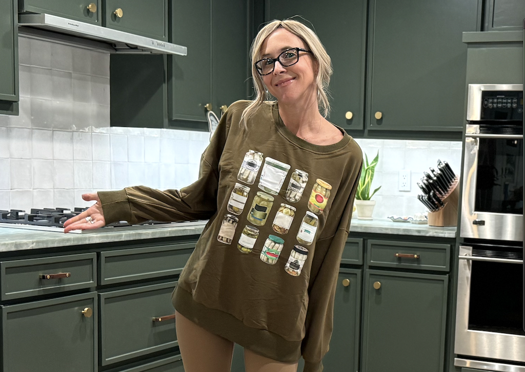 woman wearing pickle sweatshirt