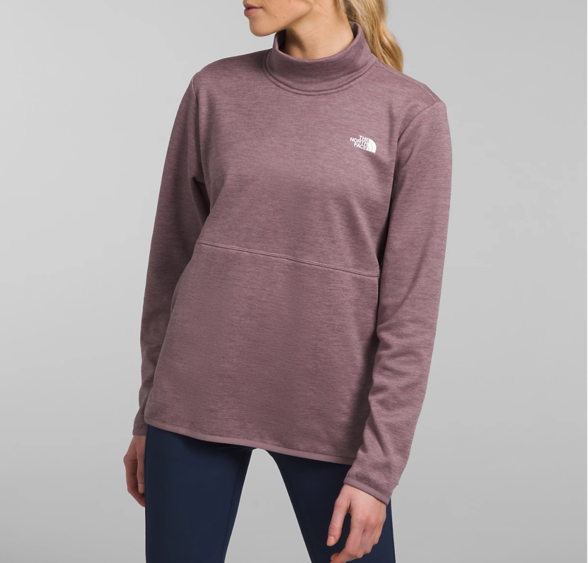 woman wearing mauve turtleneck pullover fleece