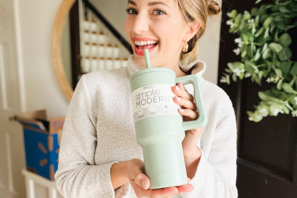 woman sipping from simple modern tumbler