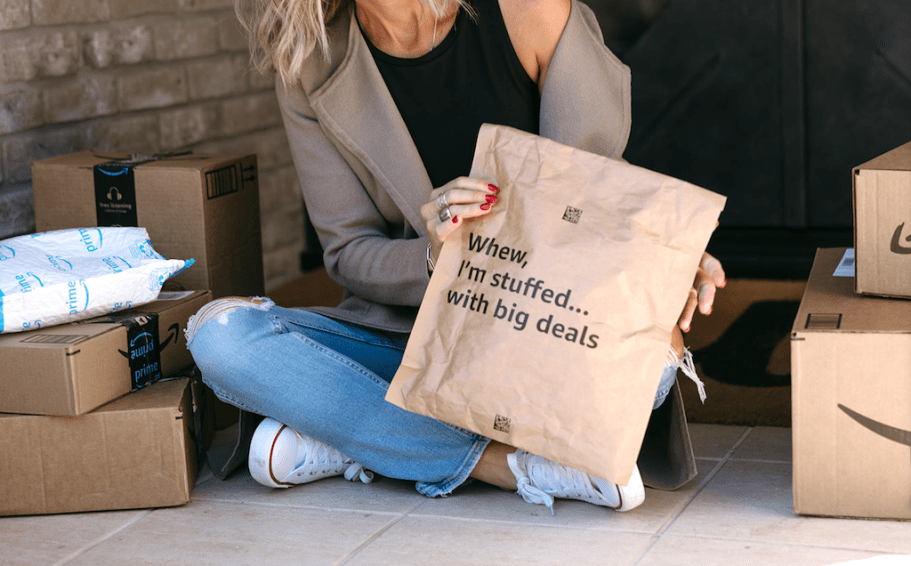 woman on porch with Amazon packages