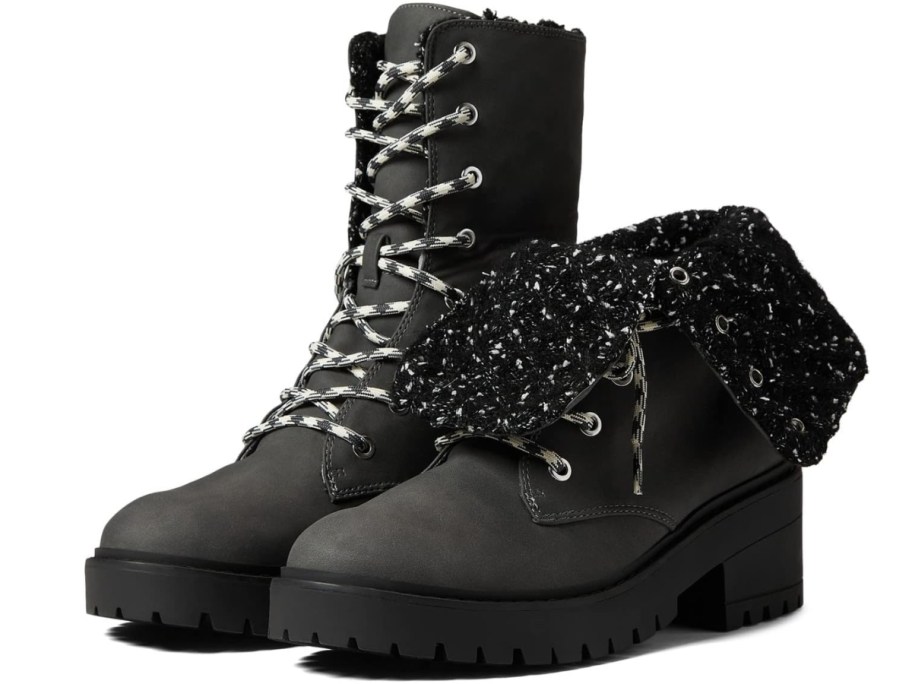 women's black lace up boots with knit detail inside, one laced up, one partially folded down