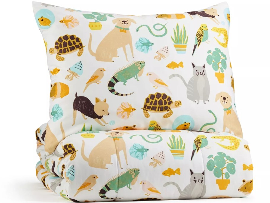 kid's comforter and sham set in white with animals and critters on it in various colors