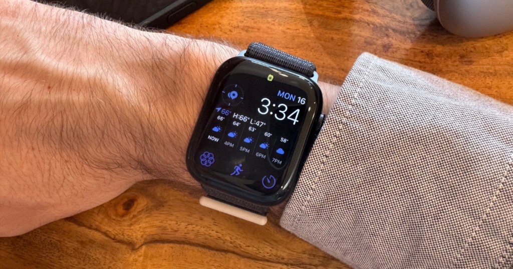 man wearing apple watch series 9 on wrist