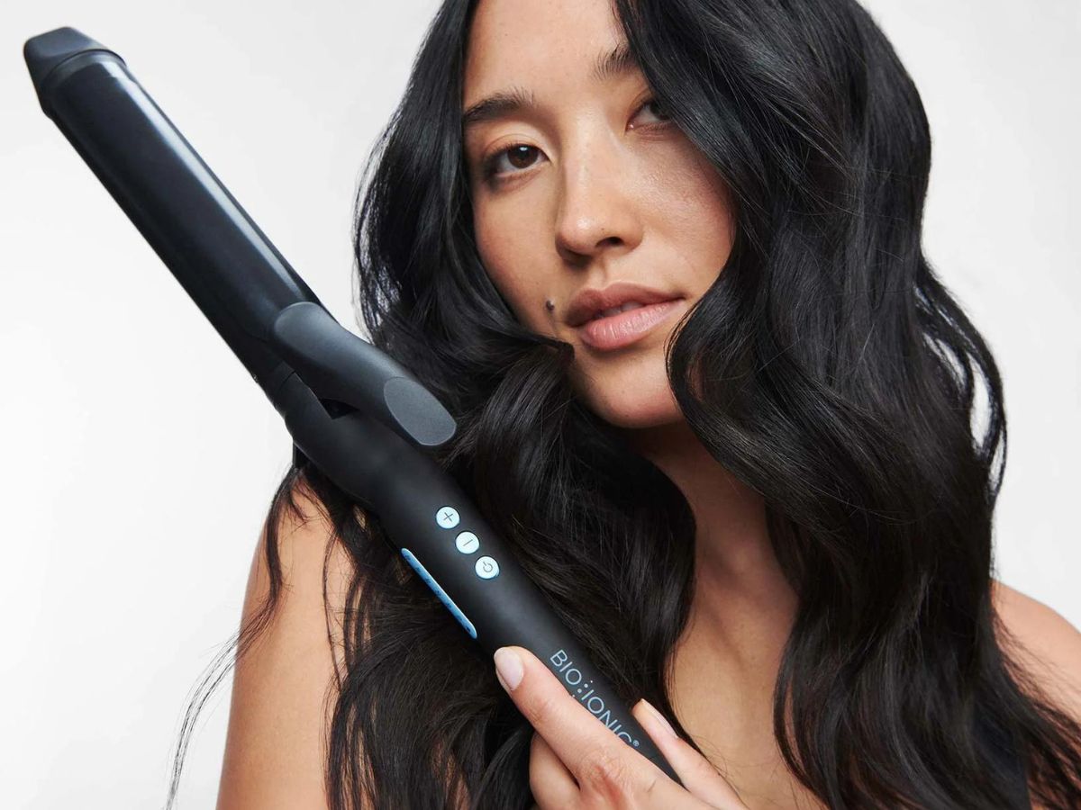 Woman using a Bio Ionic Curling Iron