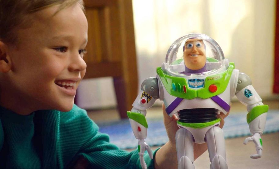 kid playing with buzz lightyear toy