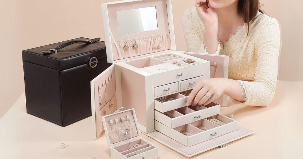 woman putting jewelry in a large Casegrace Jewelry Organizer Box