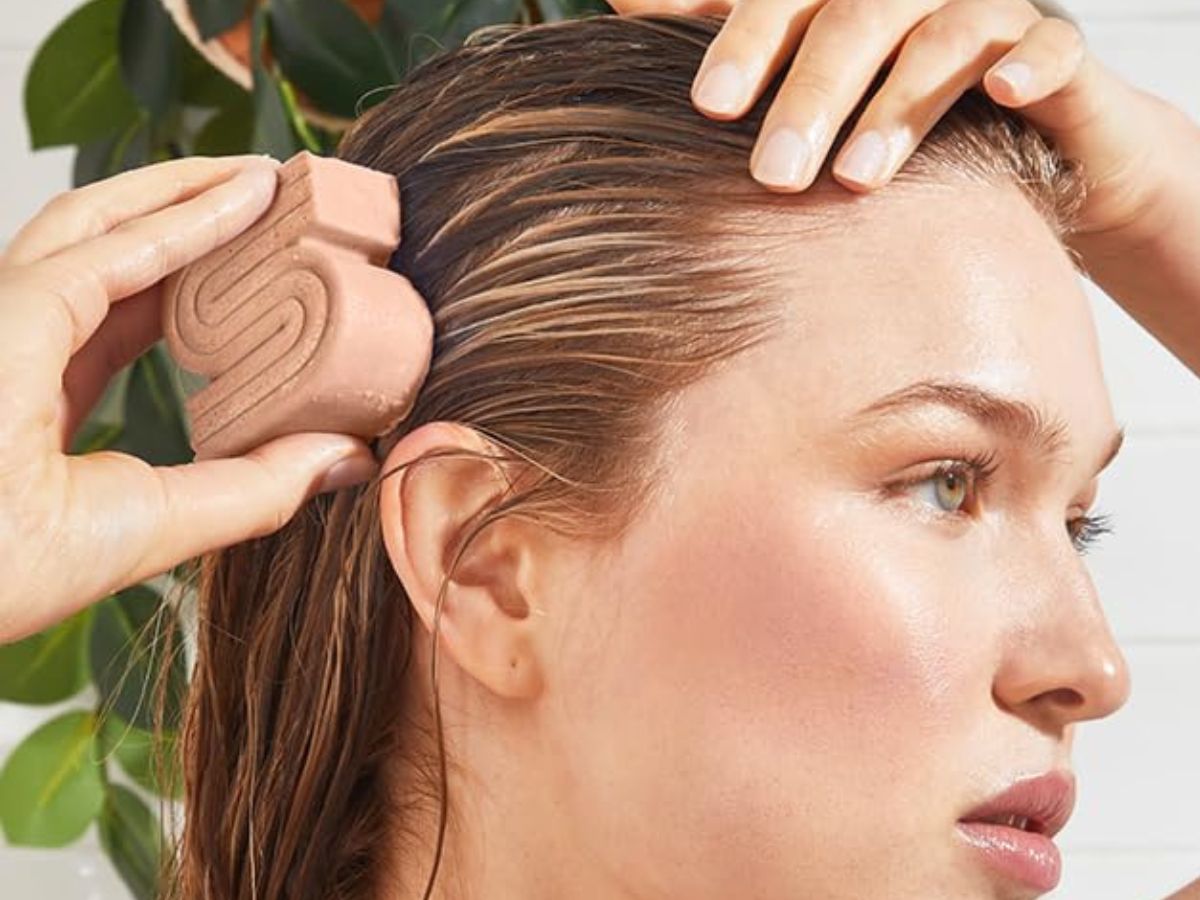 woman using rice water bar on hair