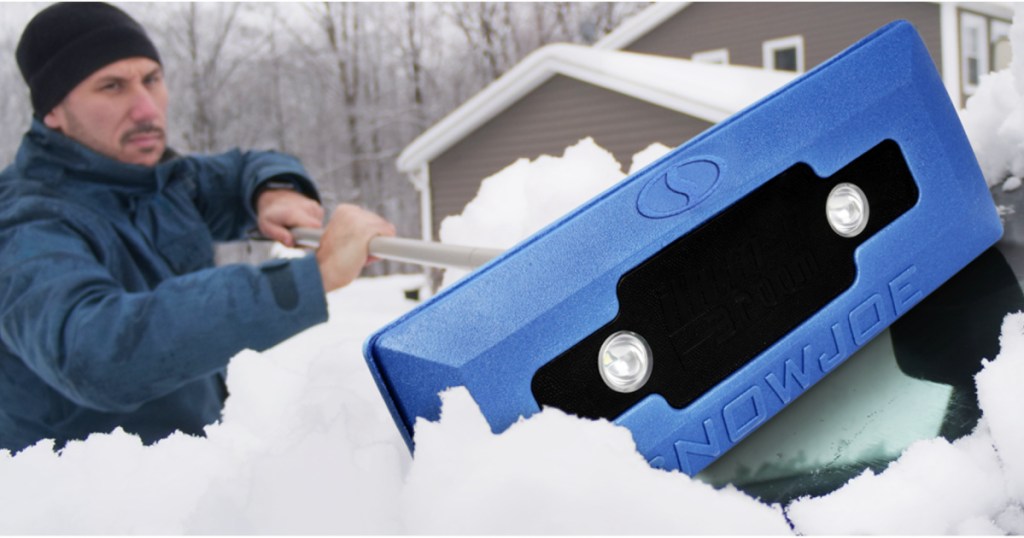 man scraping off snow with this lighted scraper broom