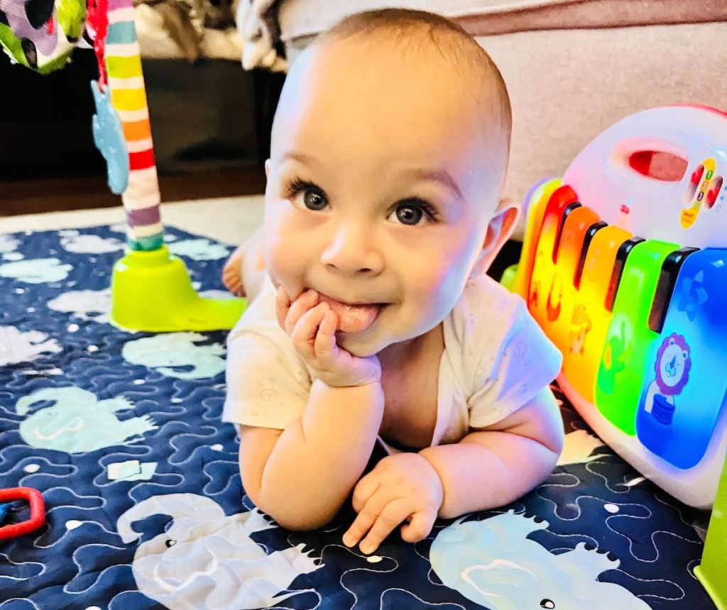 cute baby on elephant playmat