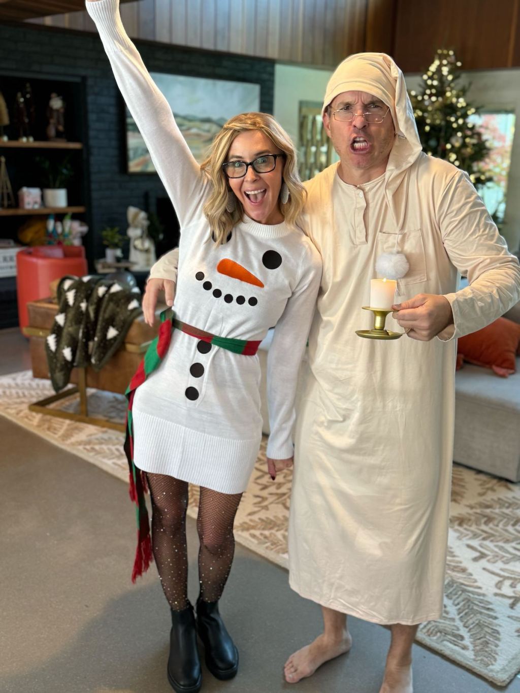 couple dressed up for holidays in living room