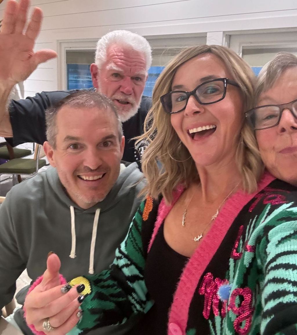 family taking selfie in kitchen