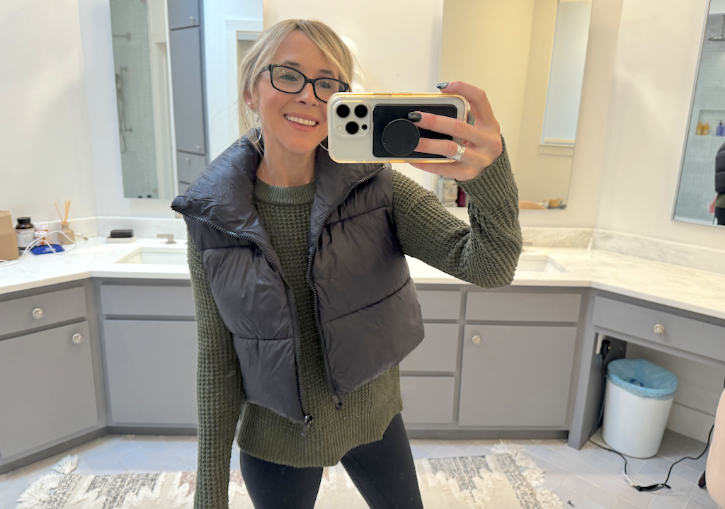 Collin wearing waffle knit sweater with cropped puffer vest