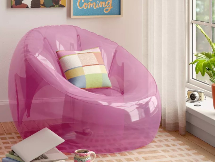 pink inflatable chair in girls room