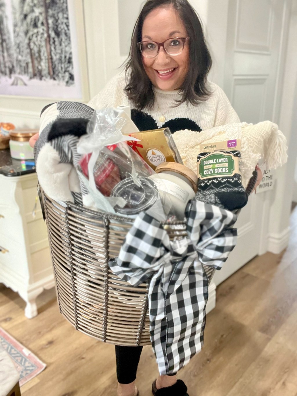 woman holding a burr gift basket