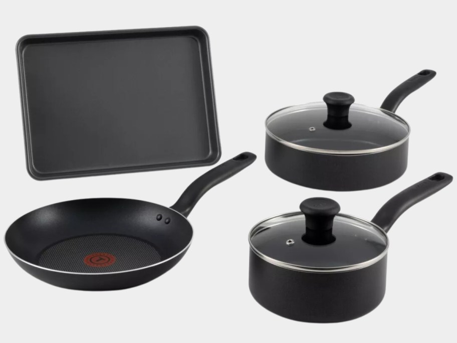 black pots with lids, frying pan and baking sheet