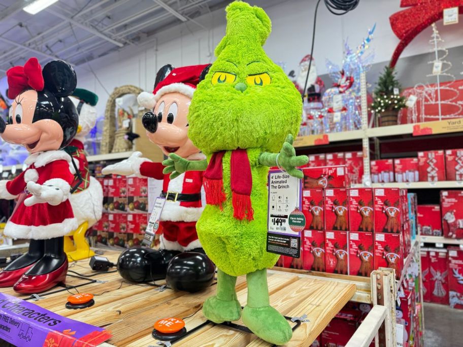 4 ft grinch holiday animatronics on display in a home depot