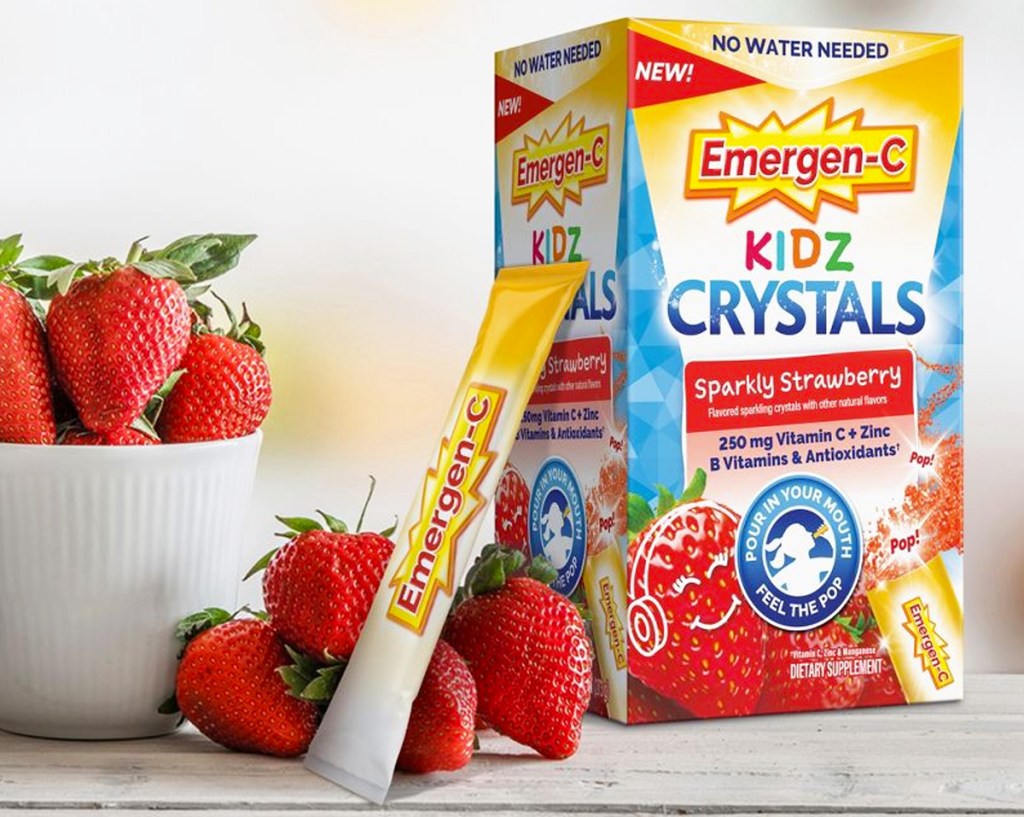 box of Emergen-C Kidz Crystals Supplement near bowl of strawberries